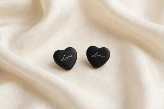 Black LUMA heart magnets — photo shows one complete pair (two pieces)