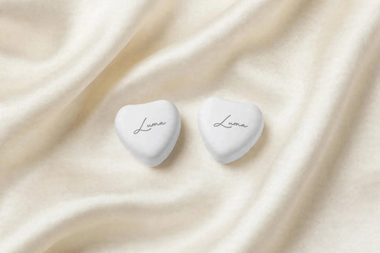 White LUMA heart magnets — photo shows one complete pair (two pieces)